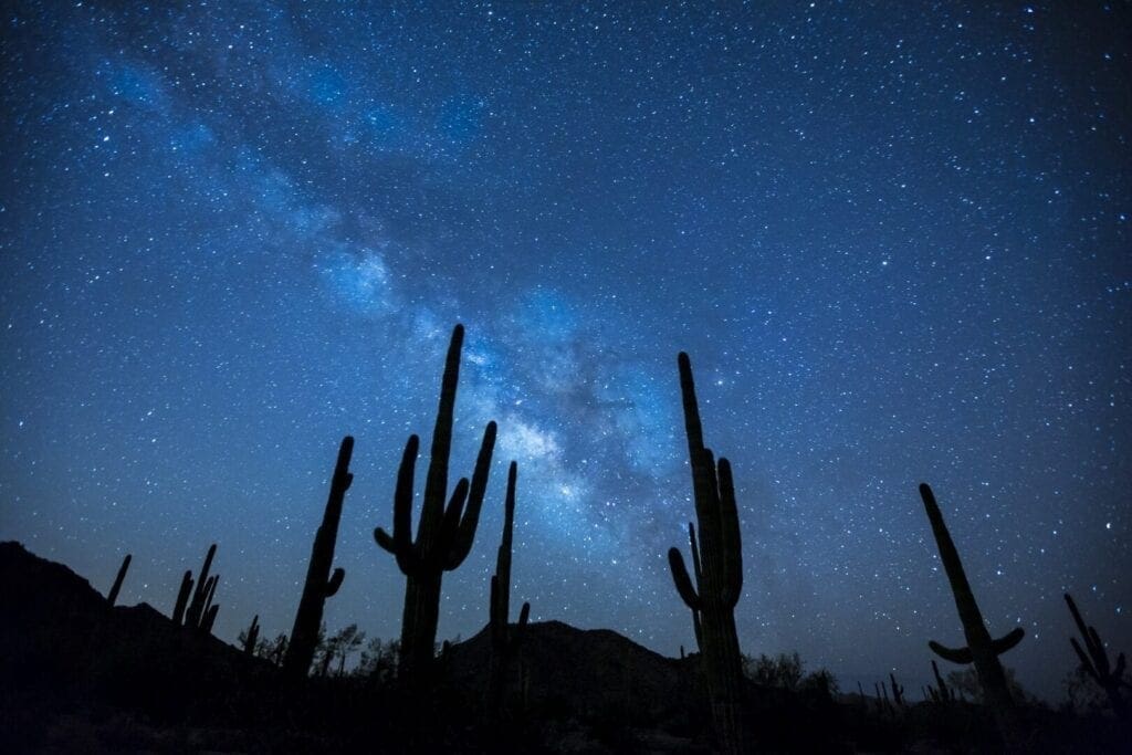 A night sky with stars and the milky way in the background.